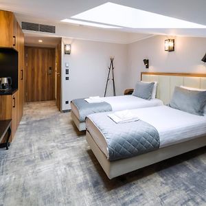 Kamer met Twee Aparte Bedden in de Zolder